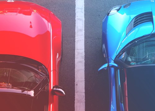 Red and Blue Car Parked Side By Side